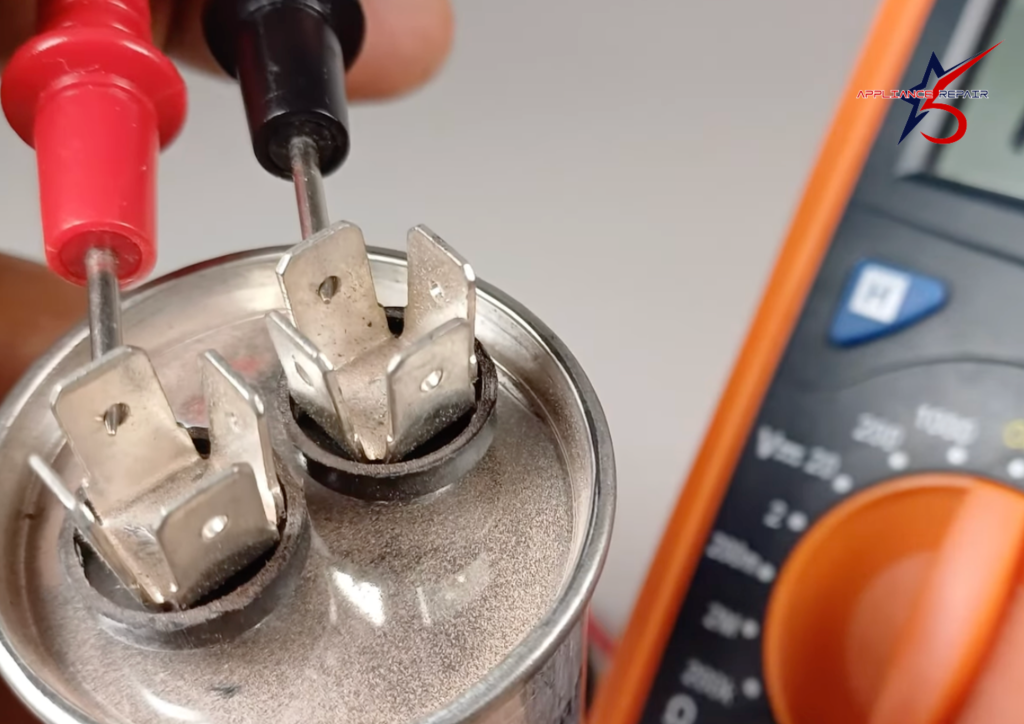 A technician using a digital multimeter to test an AC capacitor for continuity or resistance. The multimeter display shows an "OL" or open loop reading, indicating a potentially faulty component.